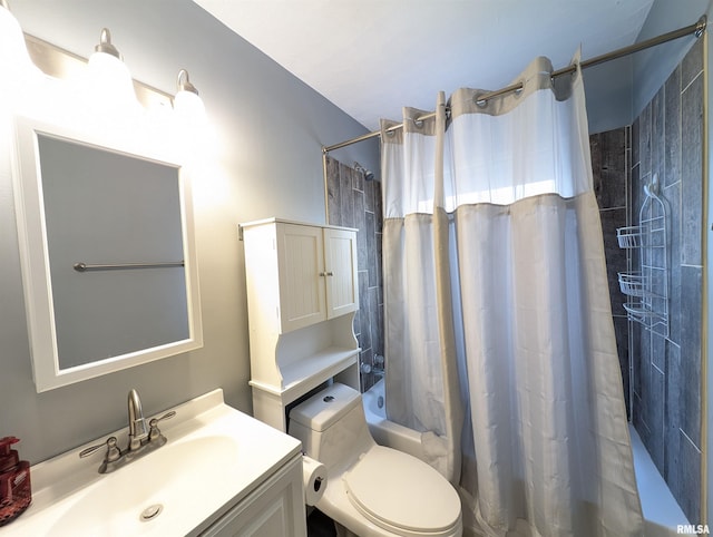 bathroom featuring toilet, vanity, and shower / tub combo