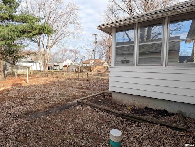 view of property exterior with fence