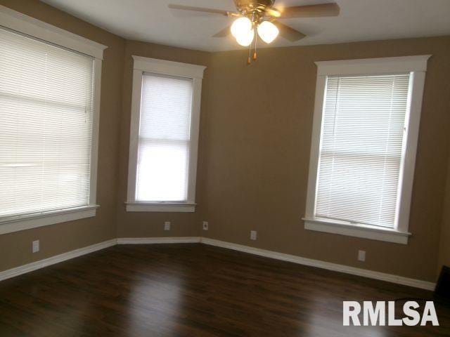 1209 S 4th St, Pekin, IL 61554 - spare room with wood finished floors and a ceiling fan