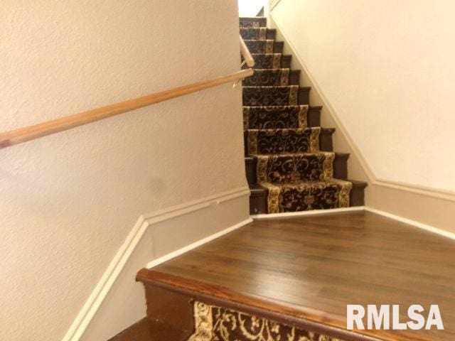 1209 S 4th St, Pekin, IL 61554 - stairs with a textured wall and wood finished floors