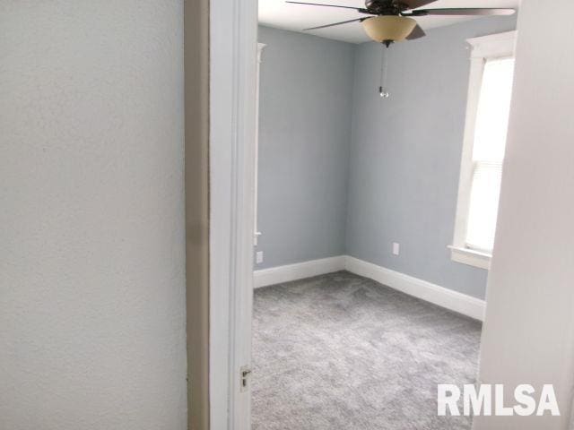 1209 S 4th St, Pekin, IL 61554 - unfurnished room featuring a ceiling fan and carpet