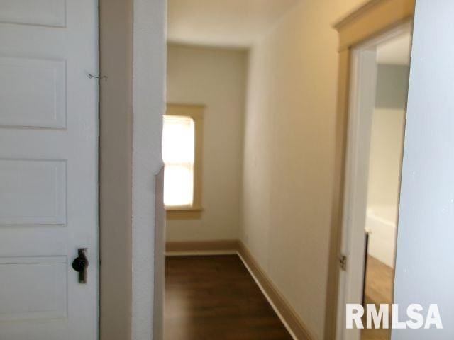 1209 S 4th St, Pekin, IL 61554 - hall featuring dark wood-type flooring and baseboards