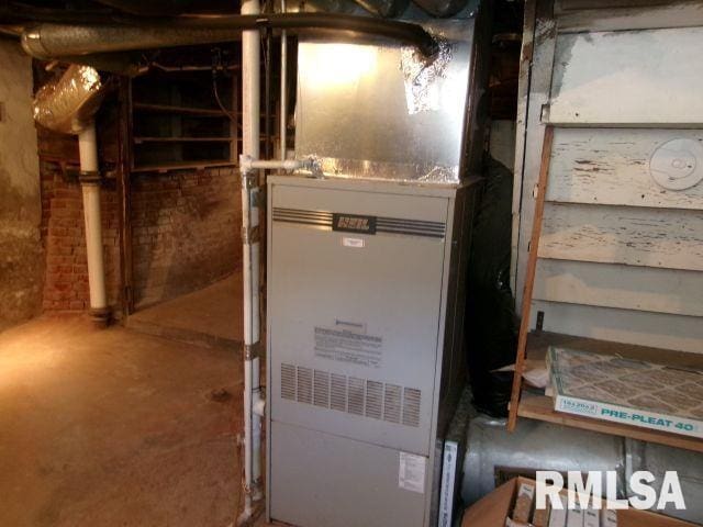 1209 S 4th St, Pekin, IL 61554 - utility room with heating unit