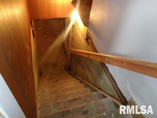 1209 S 4th St, Pekin, IL 61554 - staircase featuring wood walls