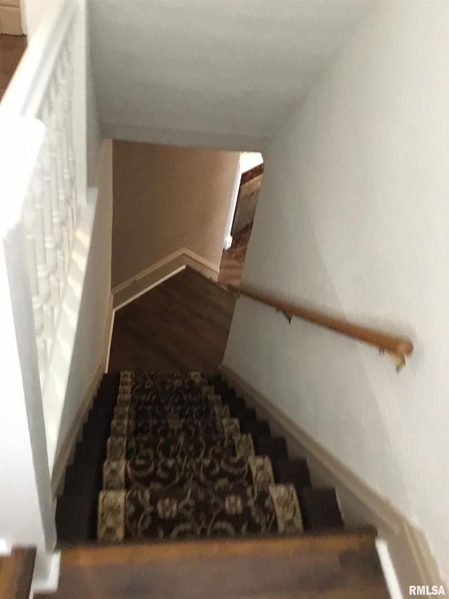1209 S 4th St, Pekin, IL 61554 - staircase with wood finished floors and baseboards