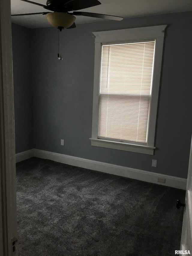 1209 S 4th St, Pekin, IL 61554 - empty room featuring dark colored carpet and a ceiling fan