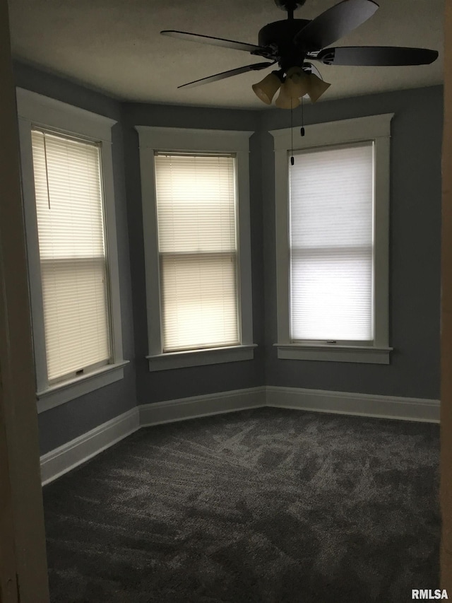 1209 S 4th St, Pekin, IL 61554 - unfurnished room featuring dark colored carpet and a ceiling fan