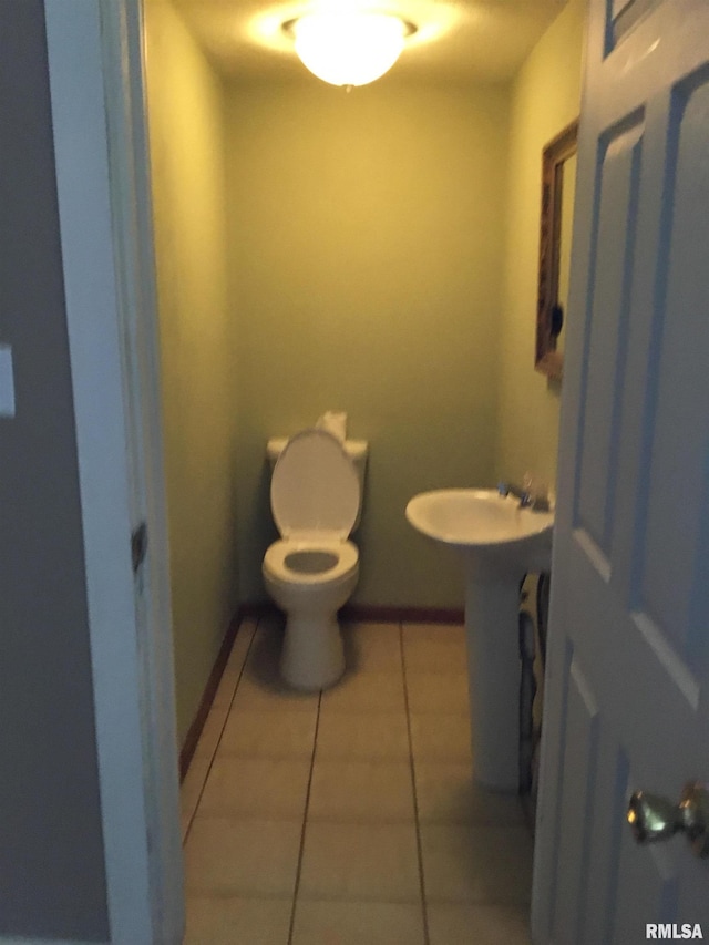 1209 S 4th St, Pekin, IL 61554 - bathroom with toilet and tile patterned floors