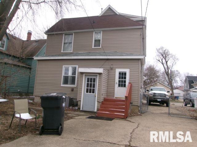 1209 S 4th St, Pekin, IL 61554 - rear view of property featuring entry steps