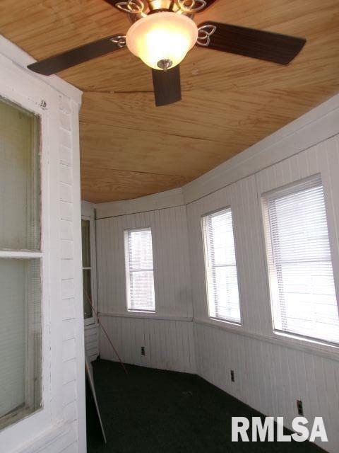 1209 S 4th St, Pekin, IL 61554 - unfurnished room with wooden ceiling and wood walls