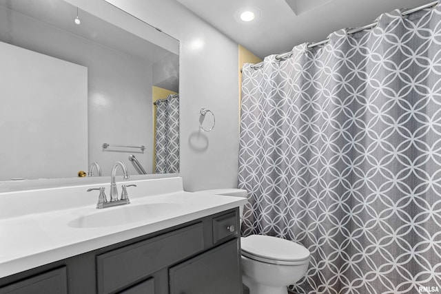 full bath featuring toilet and vanity