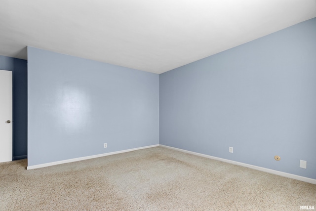 empty room featuring baseboards