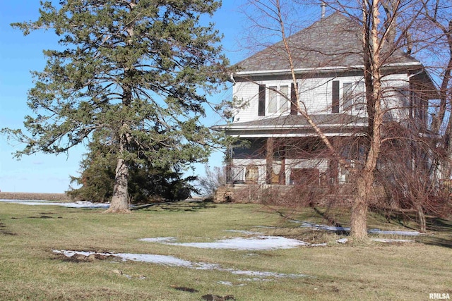 view of home's exterior with a lawn