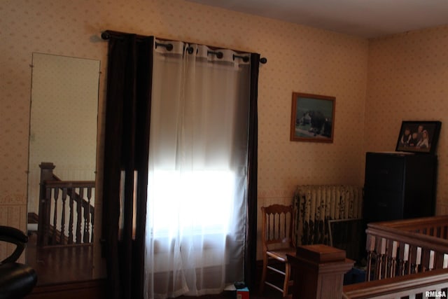 bedroom featuring wallpapered walls