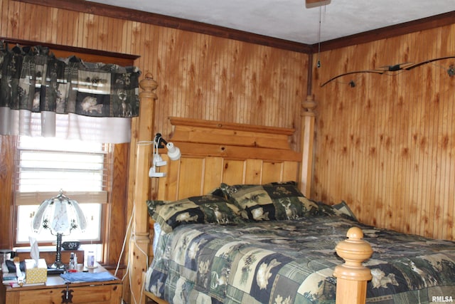 bedroom featuring wood walls