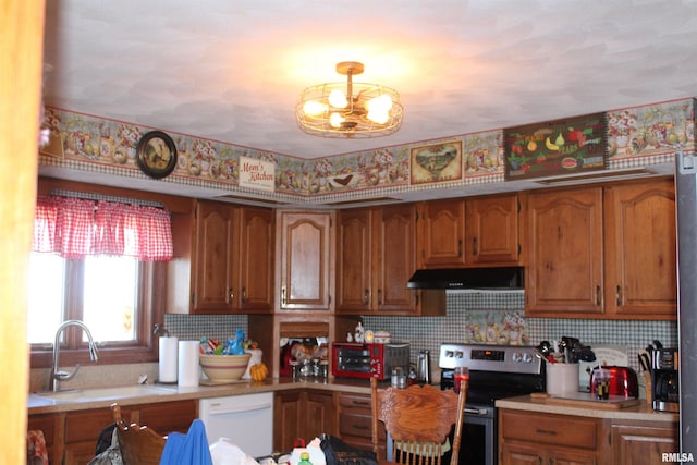 kitchen featuring a sink, stainless steel range with electric stovetop, brown cabinets, white dishwasher, and under cabinet range hood