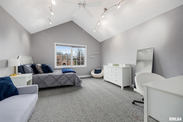 bedroom with rail lighting, ceiling fan, carpet flooring, and vaulted ceiling