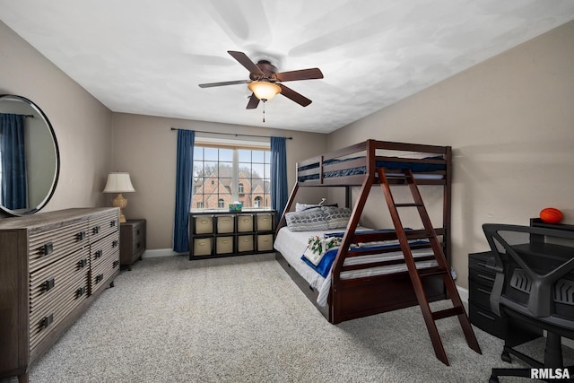 bedroom featuring a ceiling fan, baseboards, and carpet floors