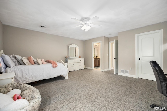 carpeted bedroom with a ceiling fan, baseboards, visible vents, and ensuite bathroom