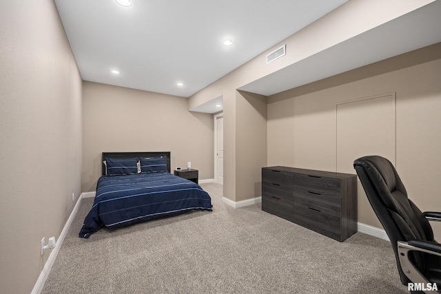 carpeted bedroom featuring recessed lighting, baseboards, and visible vents