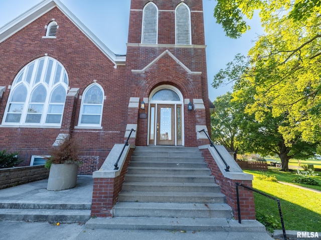 view of front of property featuring brick siding and entry steps