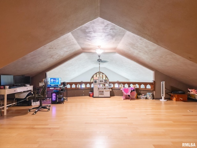 office space with vaulted ceiling and wood finished floors