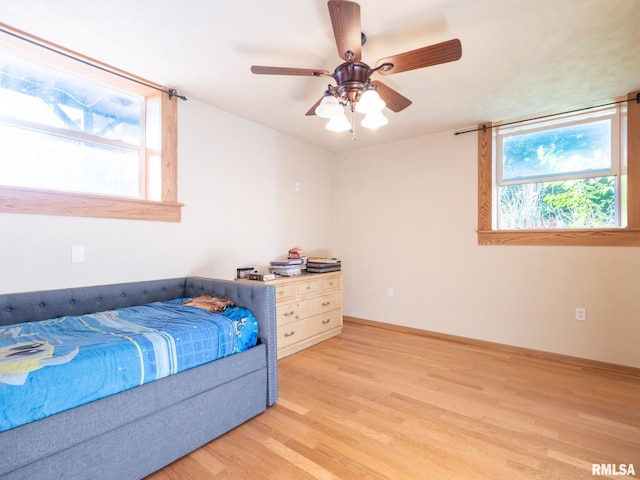bedroom featuring a ceiling fan and light wood-style flooring