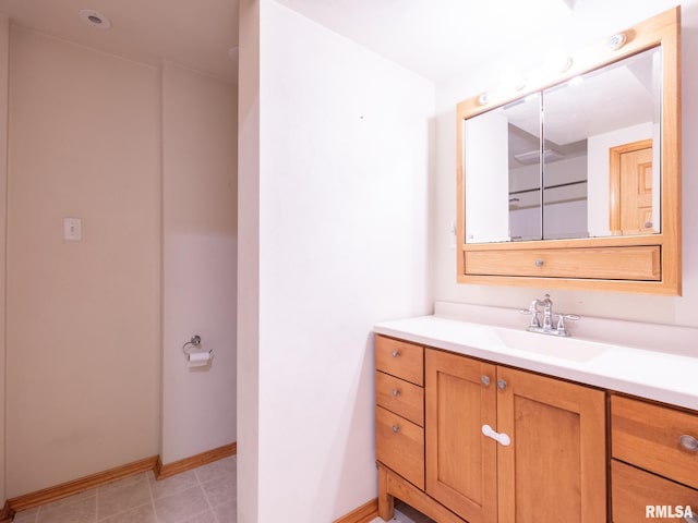 bathroom featuring baseboards and vanity