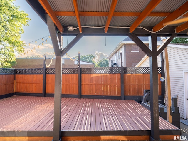 deck with a fenced backyard