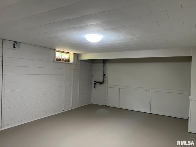 basement featuring concrete block wall