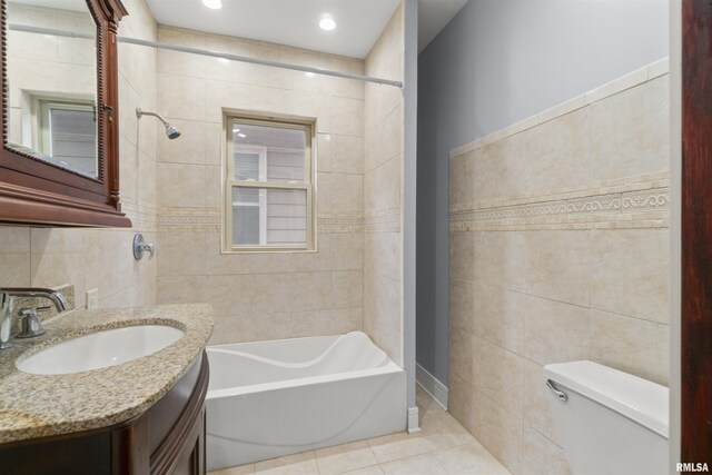 949 NE Glen Oak Ave, Peoria, IL 61603 - full bathroom with vanity, recessed lighting, tile patterned floors, toilet, and tile walls