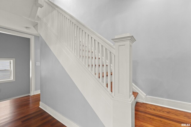 949 NE Glen Oak Ave, Peoria, IL 61603 - stairs featuring wood finished floors and baseboards