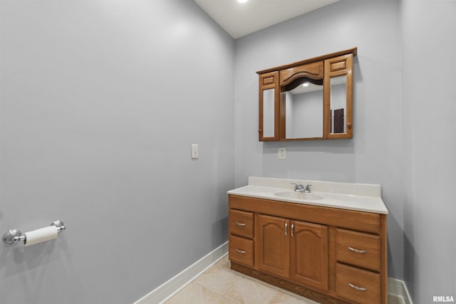 949 NE Glen Oak Ave, Peoria, IL 61603 - bathroom with tile patterned flooring, vanity, and baseboards