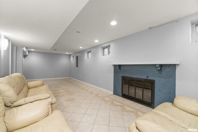 949 NE Glen Oak Ave, Peoria, IL 61603 - living room featuring light tile patterned floors, baseboards, recessed lighting, and a brick fireplace