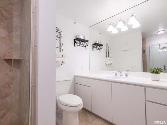 full bath featuring vanity, an inviting chandelier, toilet, a shower stall, and tile patterned floors