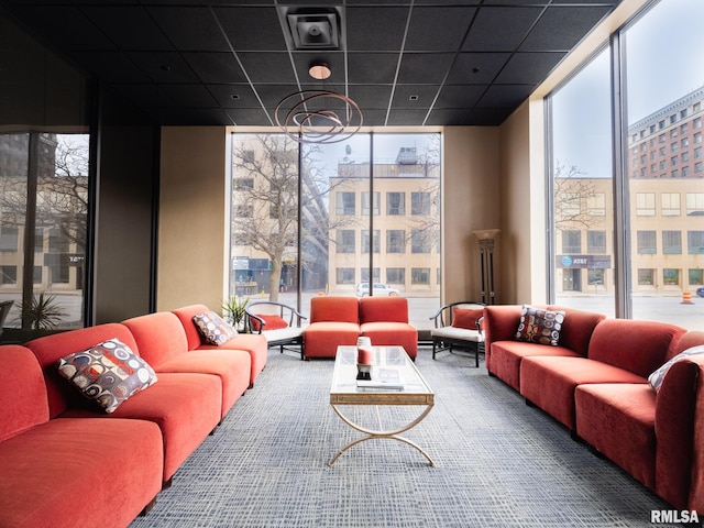 living area featuring a wall of windows
