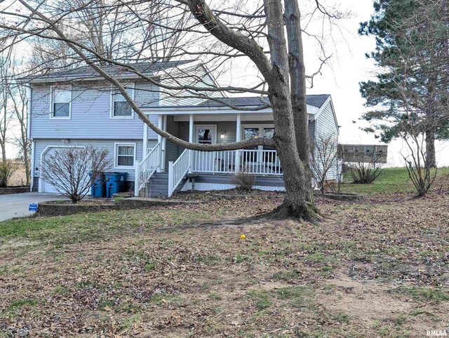 301 E Vine St, San Jose, IL 62682 - view of front of home with a porch, a garage, and stairs