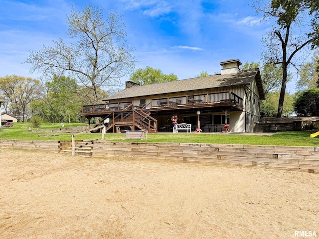10 Locust Grove Ct, Groveland, IL 61535 - back of property featuring stairway, a deck, a chimney, and a lawn