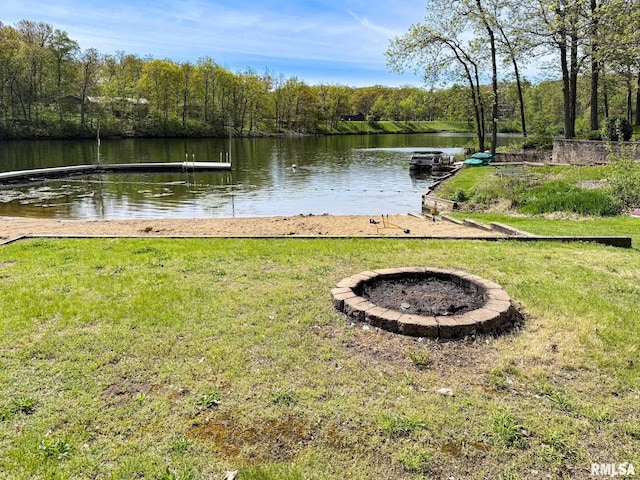 10 Locust Grove Ct, Groveland, IL 61535 - view of dock with a lawn, a water view, a fire pit, and a forest view