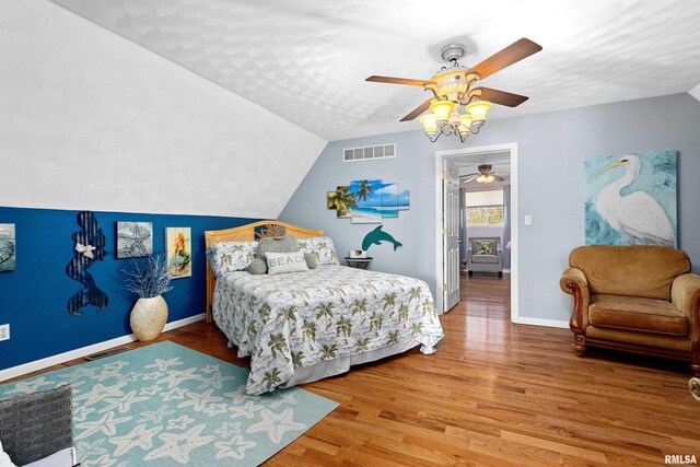 1800 Mitchell St, Pekin, IL 61554 - bedroom with wood finished floors, baseboards, vaulted ceiling, and visible vents