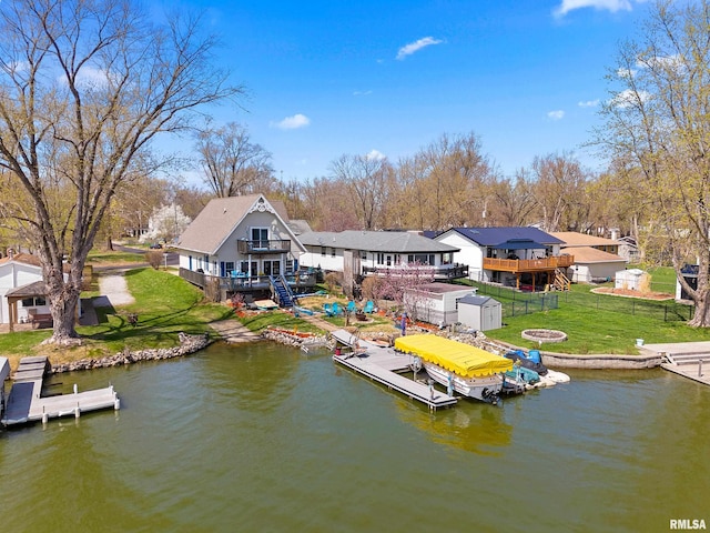 1800 Mitchell St, Pekin, IL 61554 - view of dock with a lawn, a deck with water view, fence, and stairs