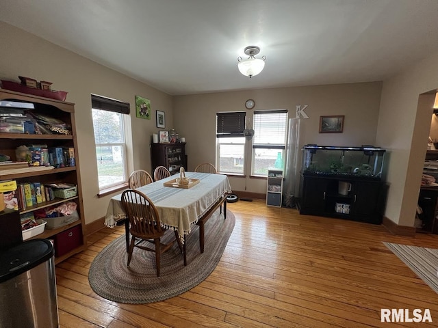 dining room with light wood-style flooring