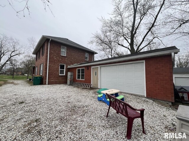 822 S Mcarthur St, Macomb, IL 61455 - view of grassy yard featuring a trampoline and a playground
