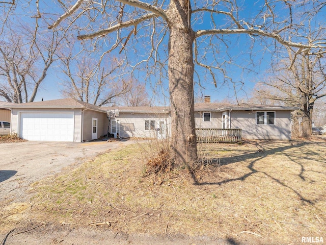 102 S Van Buren St, Lewistown, IL 61542 - single story home featuring a chimney, a wooden deck, and a garage