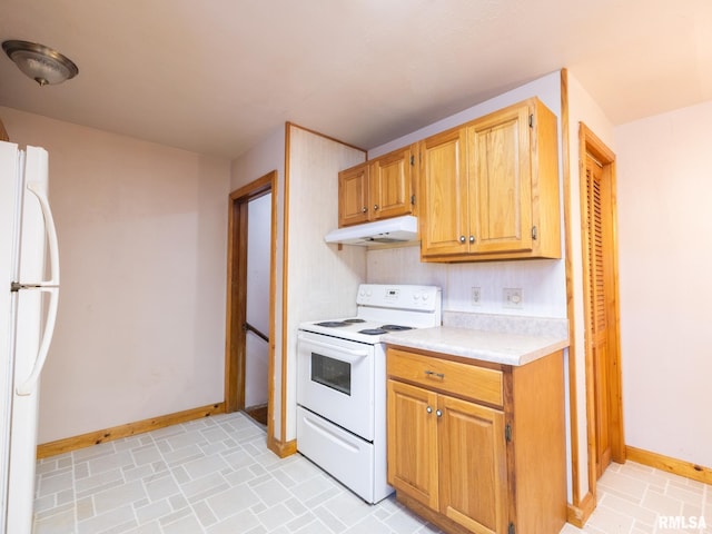 102 S Van Buren St, Lewistown, IL 61542 - kitchen featuring light countertops, baseboards, under cabinet range hood, and white appliances
