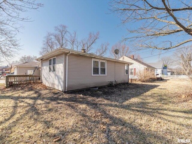 102 S Van Buren St, Lewistown, IL 61542 - view of property exterior featuring a chimney