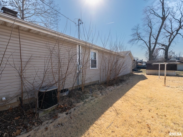 102 S Van Buren St, Lewistown, IL 61542 - rear view of house featuring central AC unit