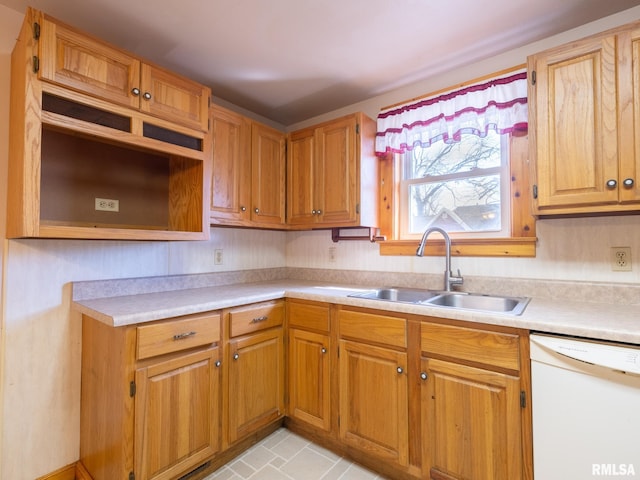 102 S Van Buren St, Lewistown, IL 61542 - kitchen with white dishwasher, light countertops, and a sink