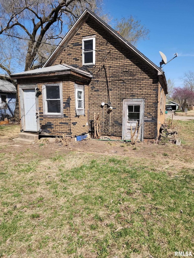 205 2nd St, South Pekin, IL 61564 - view of side of property with brick siding and a lawn