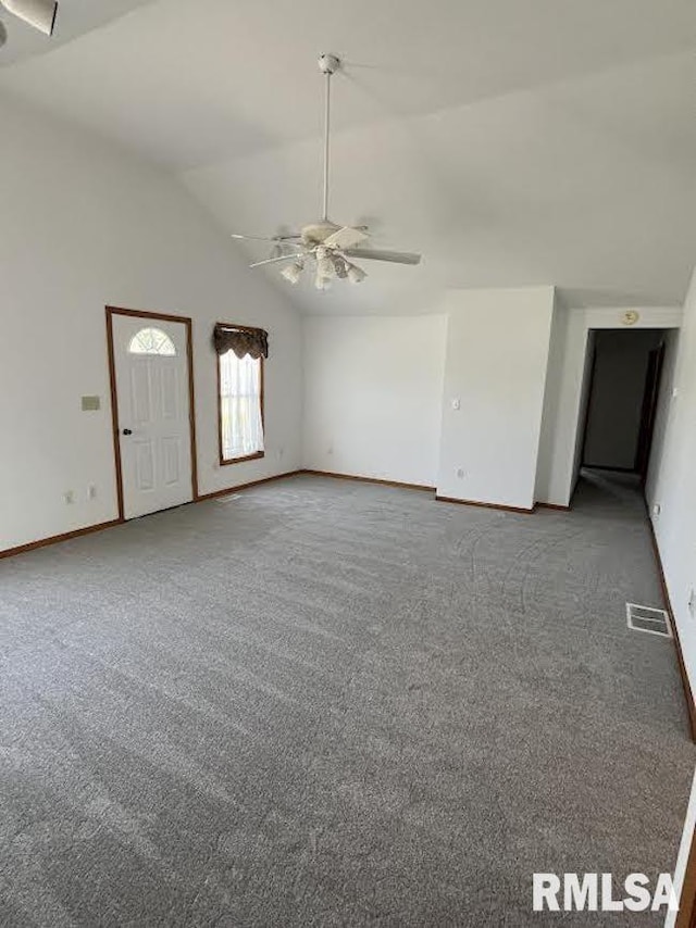unfurnished living room with vaulted ceiling, baseboards, ceiling fan, and carpet